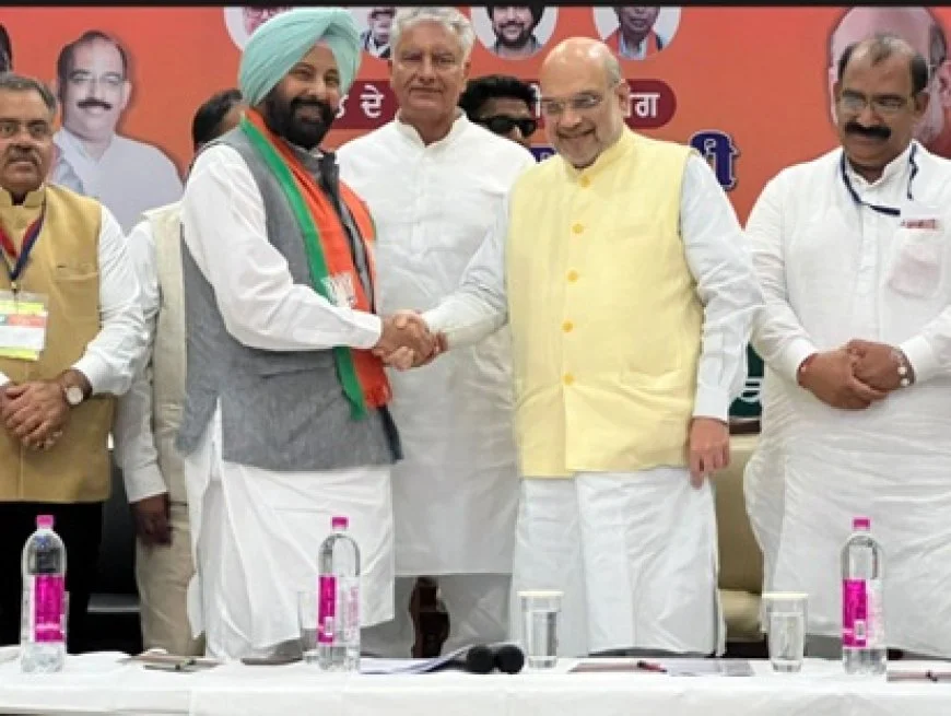 Kewal Singh Dhillon wearing a BJP scarf at his induction into the party, alongside senior leaders