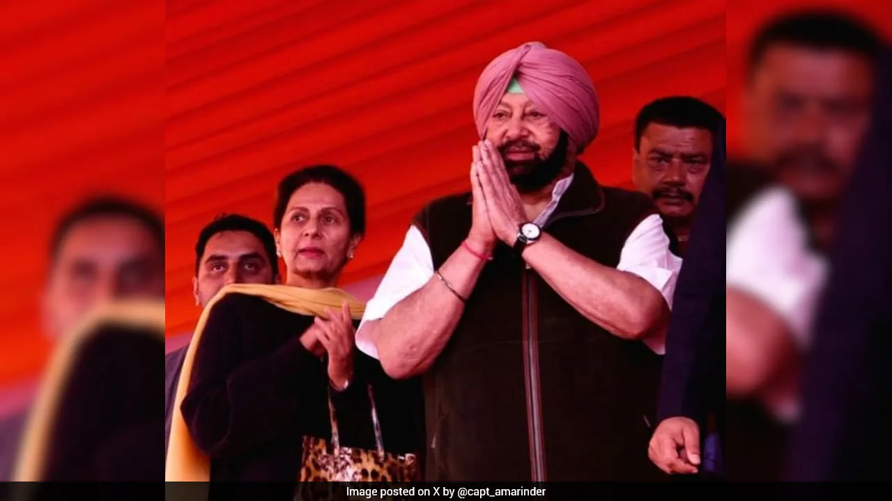 Former Punjab Chief Minister Captain Amarinder Singh greeting a crowd at a public rally
