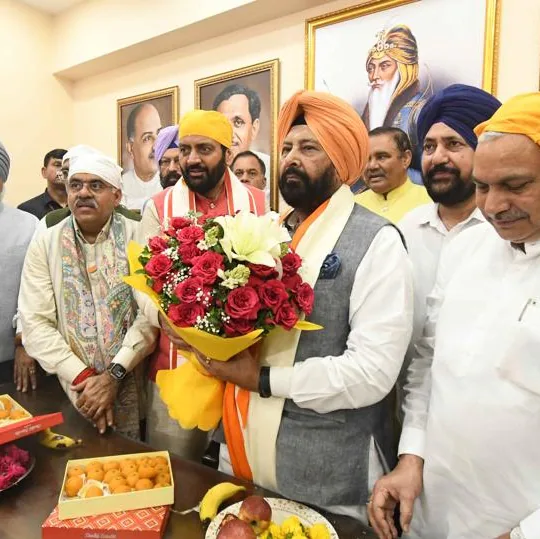 Kewal Singh Dhillon being felicitated with a bouquet by colleagues following his appointment as Punjab BJP president